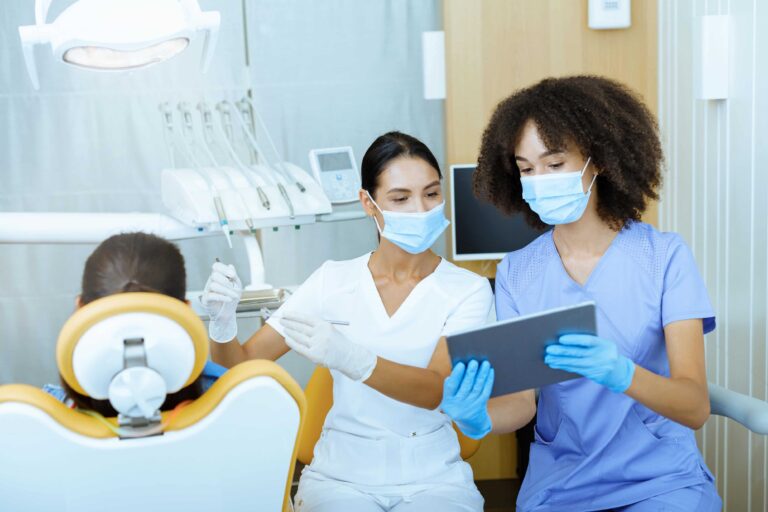 dental-assistant-shares-modern-technology-and-x-rays-in-dental-office